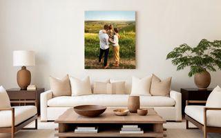 Canvas print of a family outdoors in a grassy field