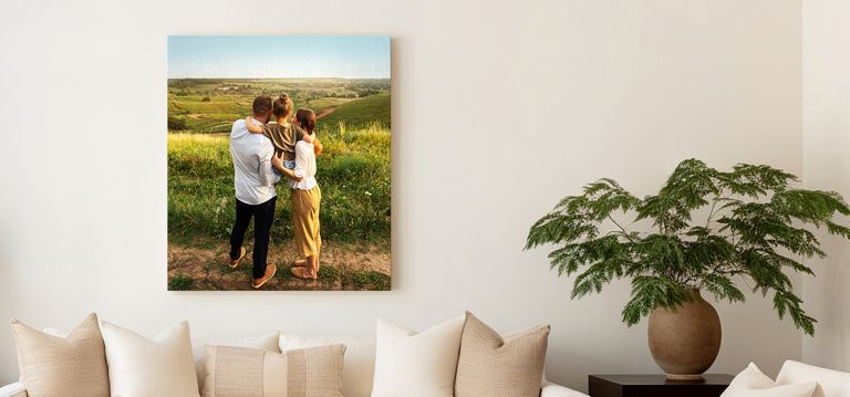Canvas print of a family outdoors in a grassy field