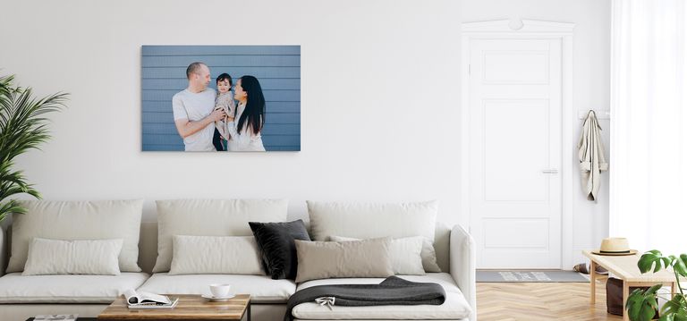 A canvas print hanging above a dining table
