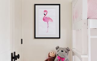 A canvas print positioned next to a kids bunk bed.