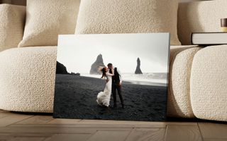 Canvas print of people in front of the mountains on a black background.