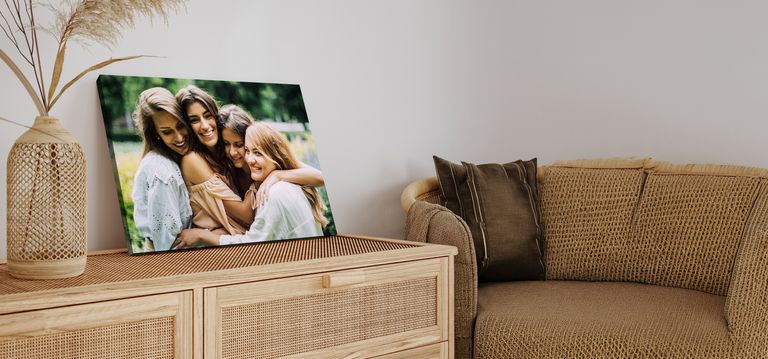 Canvas print of 4 friends hugging outside