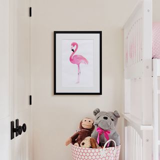 A canvas print positioned next to a kids bunk bed