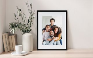 Framed print of family portrait