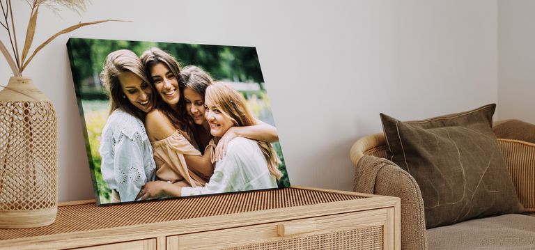 Canvas print of 4 friends hugging outside