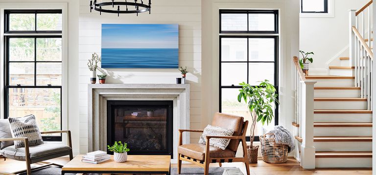 A canvas print above a fire place.