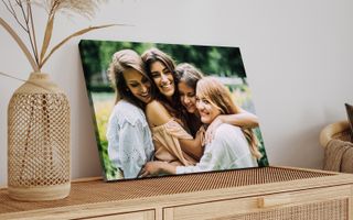Canvas print of 4 friends hugging outside