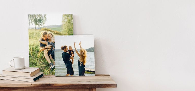 Two canvas prints of a couple outside with their baby
