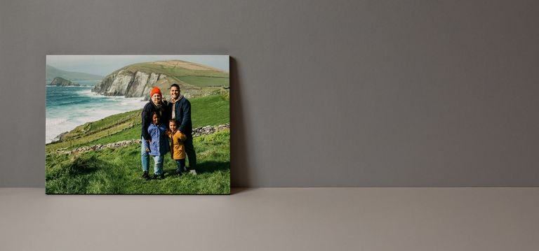 Canvas print of people in front of the mountains on a black background.