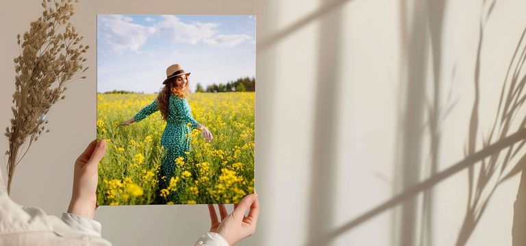 canvas print of mom walking in a flower field