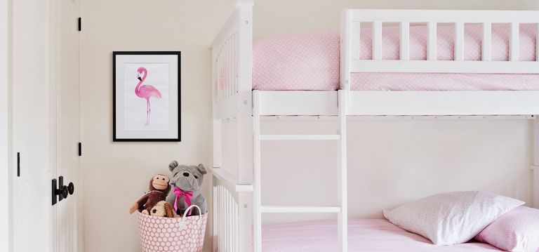 A canvas print positioned next to a kids bunk bed.